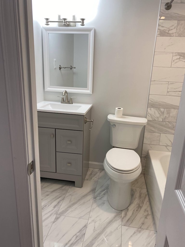 Bathroom remodeled by Smart General Contractors with modern tile and fixtures