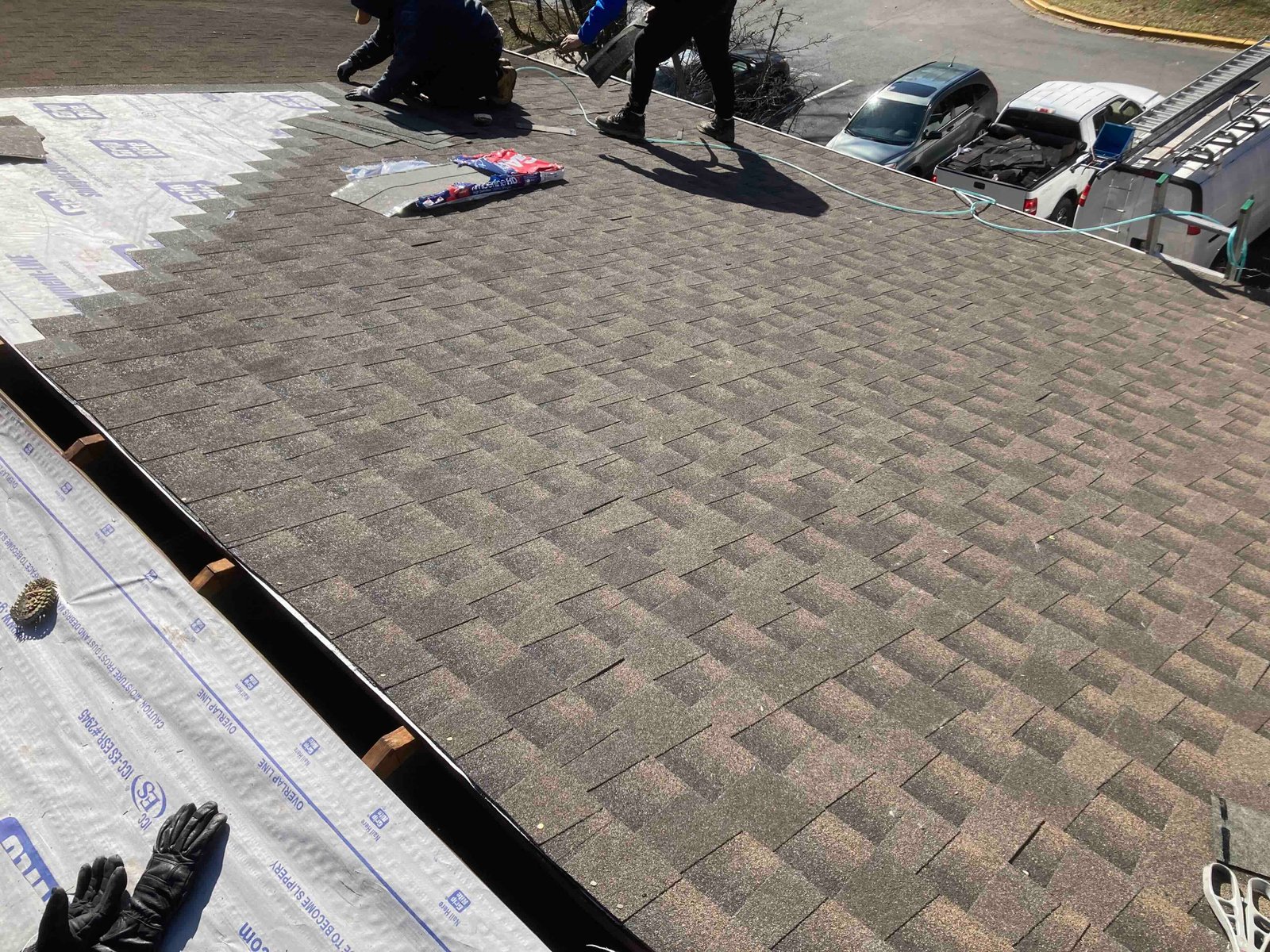 Smart General Contractors crew installing a new roof on a residential home
