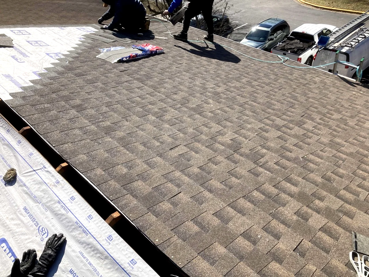 Professional roofer installing new roof